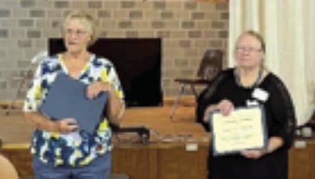 The Texas Treasure Award for the District 11 Texas Extension Education Association went to Marilyn Petrich of Fayette County. The award was accepted by her daughter, Jesse Kokemor (right), and presented by Knellen Quinteros (left), District 11 chair.