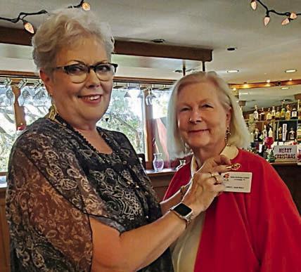 A 60-year DAR pin was presented to 1976 organizing regent, Sarah Peel Mabry (right), by DAR officer Sherry Hebert (left).