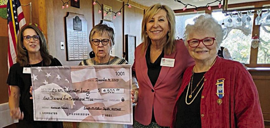 A $4,500 donat ion to th e Faison House was made by the Smith-McMillan Chapter NSDAR. Shown are (from left) Claudia Valastro, DAR member and Faison House docent; Marie Watts, treasurer and Faison Preservation Society vice president; Jackie Head; and Pamela Burke, Smith-McMillan Chapter regent.