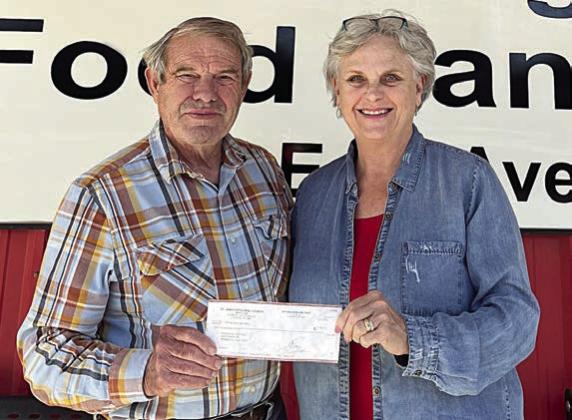 The St. James Episcopal Church Men’s Club of La Grange, also known as the Holy Smokers, represented by George Frondorf (left), recently donated $1,000 to the Schulenburg Area Food Pantry. Accepting the donation is SAFP president Debra Blansitt (right).
