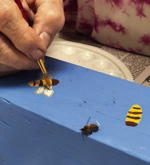 A bee served as guest model for pole painting being done by Berni Gillings.