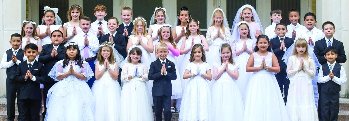 Children receive First Holy Communion at St. Rose Church