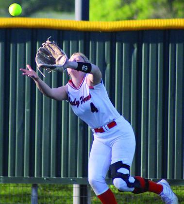 Left-fielder Angel Davis runs down a Maiden line drive. Sticker Photo By Darrell Vyvjala