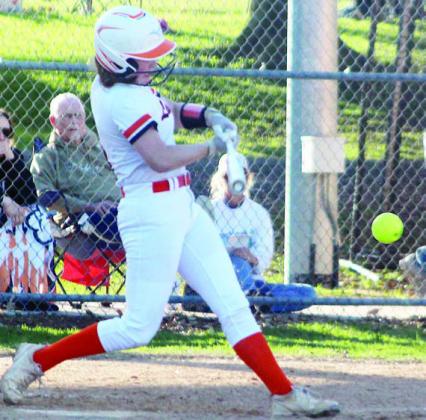 Haylie Goode sends an RBI-single to left field in the bottom of the third inning last Tuesday. Sticker Photo By Darrell Vyvjala