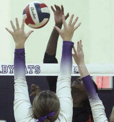 Jessalyn Gipson sends a kill past Weimar blockers early in game two. Sticker Photo By Darrell Vyvjala