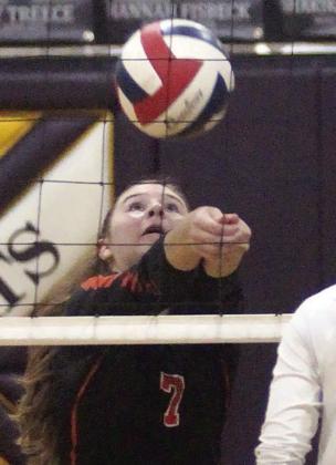 Landry Zapalac saves a ball at the net in the second set against Weimar. Sticker Photo By Darrell Vyvjala