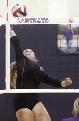 Reagan Dusek puts away the final point of the game two win over the Ladycats. Sticker Photo By Darrell Vyvjala