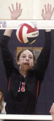 Meredith Magliolo taps down a Weimar over-pass in the first set. Sticker Photo By Darrell Vyvjala