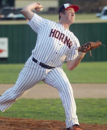 Connor Fogle delivers a pitch in the first inning to fan a Hornet, one of his six strikeouts. Sticker Photo By Darrell Vyvjala