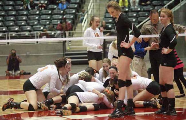 The Lady Horns celebrate their state championship as a pair Lindsay players show their disappointment.