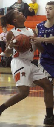 Byron Johnson draws a foul on a second-half drive Saturday morning. Sticker Photo By Darrell Vyvjala