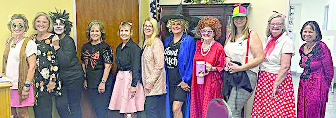Members wh o had fun while “getting in the spirit” included (from left) Diana Mikesky, Sue Broadwater, Marilyn Mokwa, Connie Kocurek, Veronica Smith, Suzette Surman, Debra Blansitt, Betty Herzik, Amy Lanouette, Becky Garlick and Natalie Horak.