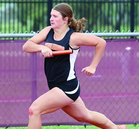 Landry Zapalac sprints around the curve in the 400-meter relay. Photo By Melanie Berger / Courtesy of Flatonia Argus
