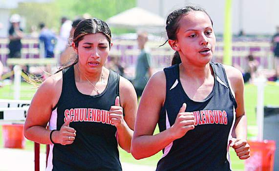 Ruby Rodriguez and Yasmin Cortez run their way to second- and third-place finishes in the 1600-meter event. Photo By Melanie Berger / Courtesy of Flatonia Argus