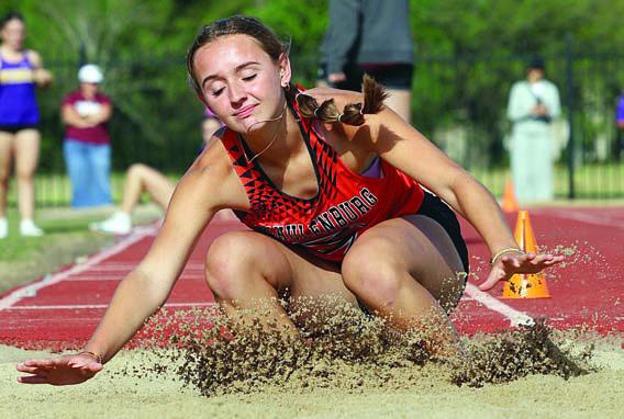 Miranda Bonner hits the sand in the long jump. Photo By Melanie Berger / Courtesy of Flatonia Argus