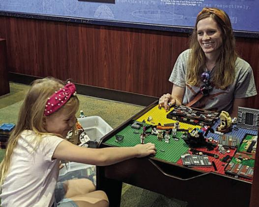 Building with Legos was one of the activities at the Worldwide Day of Play. This table with red, green, yellow and blue squares holds a variety of Lego pieces from which to choose.