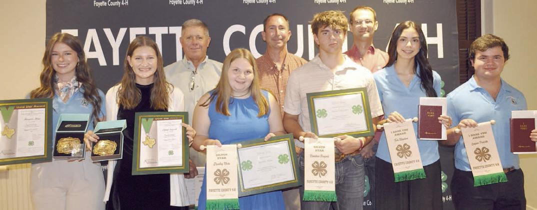 Senior Awards – (front row, from left) Harper Mau, Elena Supak, Brealey Nieto, Kandon Kaspar, Tori Newton and Logan Poncik. Presenters – (back row) Commissioner Harvey Berckenhoff, Commissioner Jason McBroom and Commissioner Clint Sternadel.