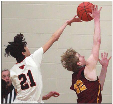 Alex Lozano collects one of his six blocked shots against Thorndale. Sticker Photo By Darrell Vyvjala