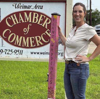 Garden Pole – Tiffany Hougardy, executive director of the Weimar Chamber of Commerce, received a gift of a garden pole painted by Berni Gillings in appreciation for the Weimar Chamber’s support of Senior Connections.