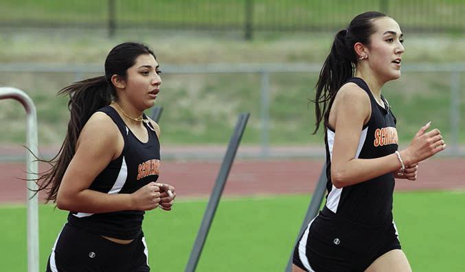 Makena Kopecky (right) and Ruby Rodriguez run their way to the top two places in the 3200-meter run. The pair also placed first and second, respectively, in the 1600-meter event. Photo By Melanie Berger / Courtesy of Flatonia Argus