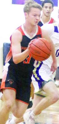Caden Herzik gets a first-quarter steal in Shiner. Sticker Photo By Darrell Vyvjala