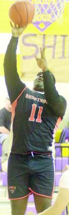 Tavondrick Ellison scores at the basket in the third quarter in Shiner. Sticker Photo By Darrell Vyvjala