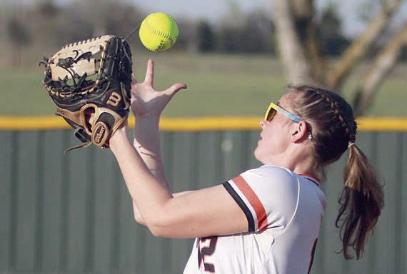 First baseman Summer Livingston makes a juggling catch of a Lady Bobcat popup. Sticker Photo By Darrell Vyvjala