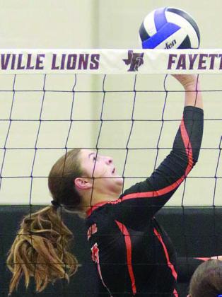 Landry Zapalac gets to a pass near the net to make a onehanded set in game one. Sticker Photo By Darrell Vyvjala