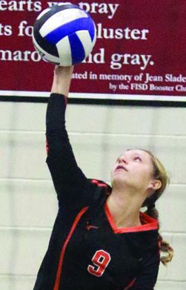 Michaela Kollmann serves an ace to end the first set. Sticker Photo By Darrell Vyvjala