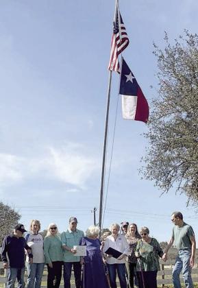 The home of Carol Lighthill in Columbus was selected to receive the February award for flag display by the Daughters of the American Revolution, John Everett Chapter, and the Sons of the American Revolution, Robert Rankin Chapter. Shown are the DAR/SAR representatives and the honoree – (front row, from left) Rick and Stephanie Mattix, Wanda Anglin, David Zachmeyer, Carol Lighthill, Judy Zachmeyer, Donna Pustejovsky, Nelma and Glen Strey, and (back) Debra and Brian Thye.