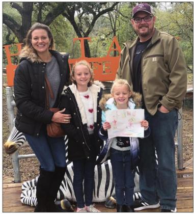 WINNER OF TICKETS TO HATARI – Penelope Bartek (second from right) won four tickets to Hatari Wildlife Park. She is shown with her mother Cara Bartek (left), father Matt Bartek (right) and sister Caroline (second from left).
