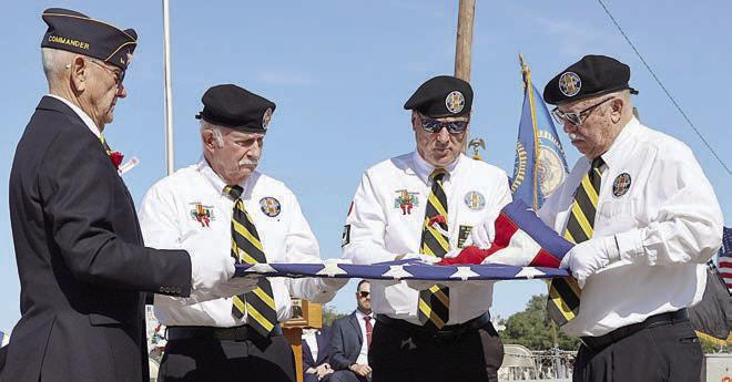 Participating in the folding of the flag ceremony were (from left) Flatonia American Legion Post 94 commander Danny Vyvjala, Vietnam Veterans of America Chapter 870 members Larry Hoffman and Donnie Christen, and Vietnam Veterans of America Chapter 870 president Andy Janda.