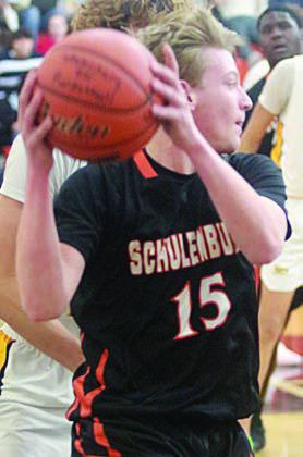 LJ Schindler chases down a loose ball in the Horns’ win over Sealy. Sticker Photo By Darrell Vyvjala