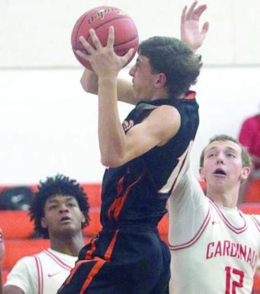 Van Prihoda pulls down an offensive rebound in the second quarter against Columbus. Sticker Photo By Darrell Vyvjala