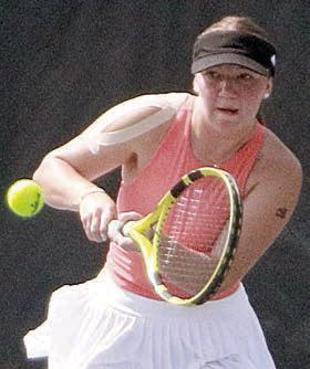 Mikayla Otto sends over a backhand volley during the state tournament match. Sticker Photo By Darrell Vyvjala