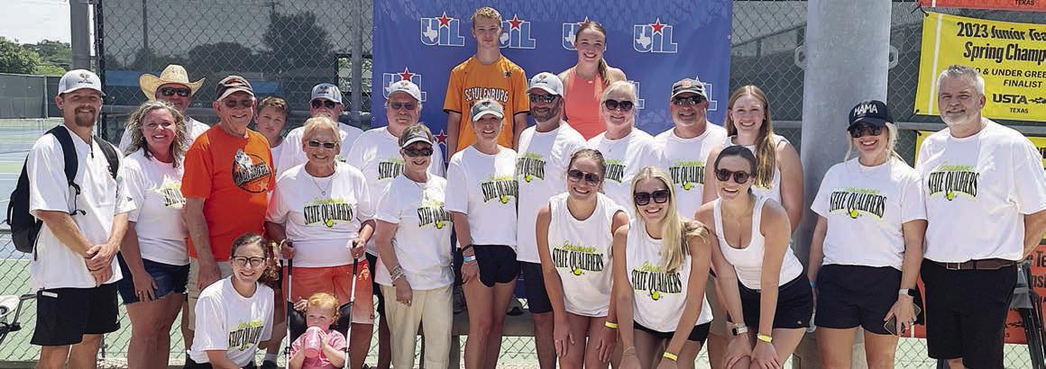 Family, friends, and fans pose with Caden Herzik and Mikayla Otto following their match at the state tournament. Sticker Photo By Darrell Vyvjala