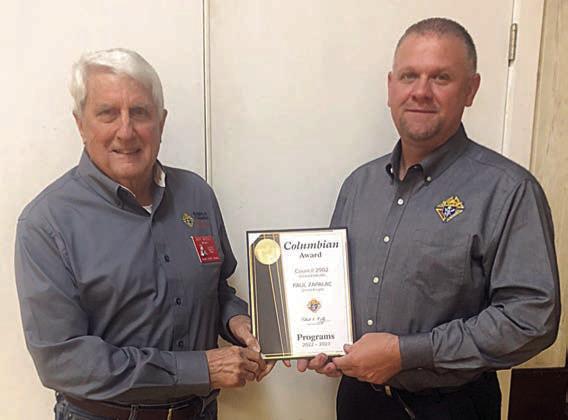 Council 2902 Grand Knight Paul Zapalac (right) accepts the Colmubian award from District 190 Deputy Jack Muggli (left).