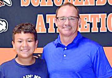 Aaron Machac (right), pictured with his son, won closest-to-the-pin in golf.
