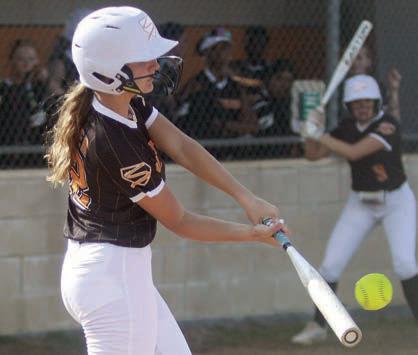 Miranda Bonner connects for a hit against Bloomington. Sticker Photo By Darrell Vyvjala