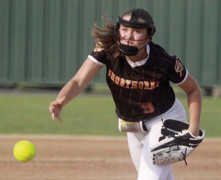 Kerr McBride releases a pitch to strike out a Lady Bobcat. Sticker Photo By Darrell Vyvjala