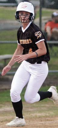 Mallory Bonner rounds third and heads home with a run last Tuesday. Sticker Photo By Darrell Vyvjala