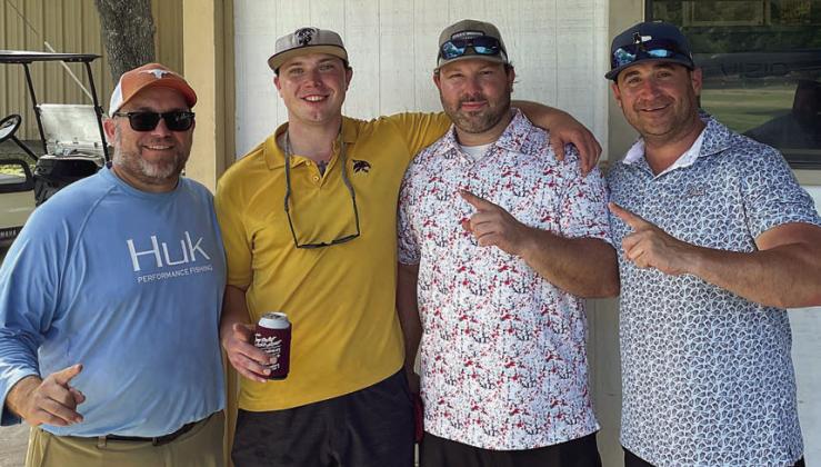 First Flight, First Place (14 under par / 58) – (from left) Darrell Vyvjala, Kade Vyvjala, Clayton Besetzny, and Tommy Brown.