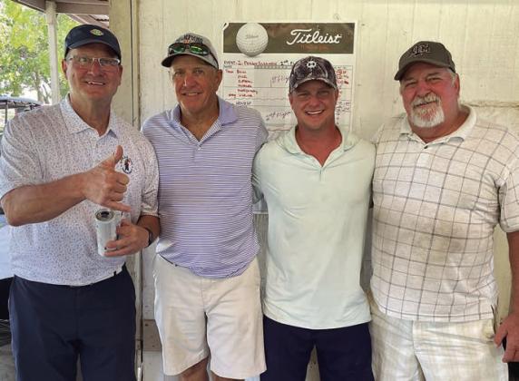 Second Flight, First Place (7 under par / 65) – (from left) Randy Hengst, Leonard Kunz, Brock Hollas, and Glenn Hollas. Sticker Photo By Darrell Vyvjala