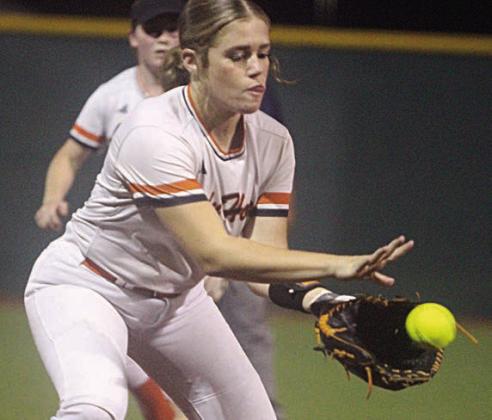 Third baseman Hailey Kahlden looks a ground ball into her glove before throwing to first in game two. Sticker Photo By Darrell Vyvjala