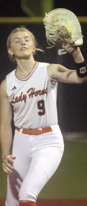First baseman Olivia Mathis secures a popup in game two. Sticker Photo By Darrell Vyvjala