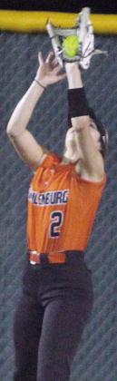 Centerfielder Fay Kutac gathers in a fly ball in game one. Sticker Photo By Darrell Vyvjala