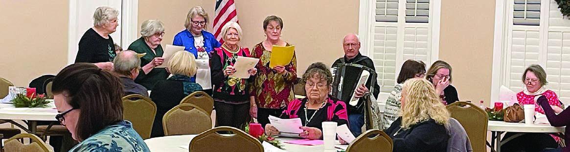 Singing of Czech songs by members and guests at the Christmas party was led by some of the Fayette County Czech Heritage Society members.