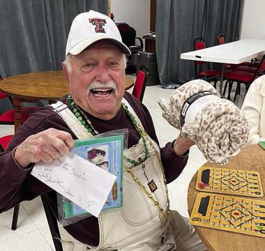 Bingo winner Jim Walker said, “I’m cleaning up!” as he won a $20 gift certificate to Robert’s Steakhouse and two other prizes.