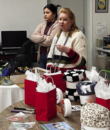 VIP bi ngo callers at the Mardi Gras breakfast and bingo on Fat Tuesday were Tammy Trebig (front) and Araseli Lara (back) from Partners Insurance in Schulenburg.