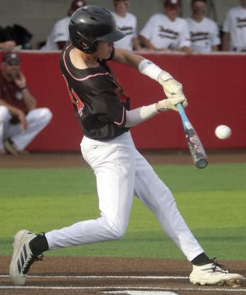 Eli Blansitt sends an single to left field to drive in the Horns’ only run in the top of the seventh inning. Sticker Photo By Darrell Vyvjala